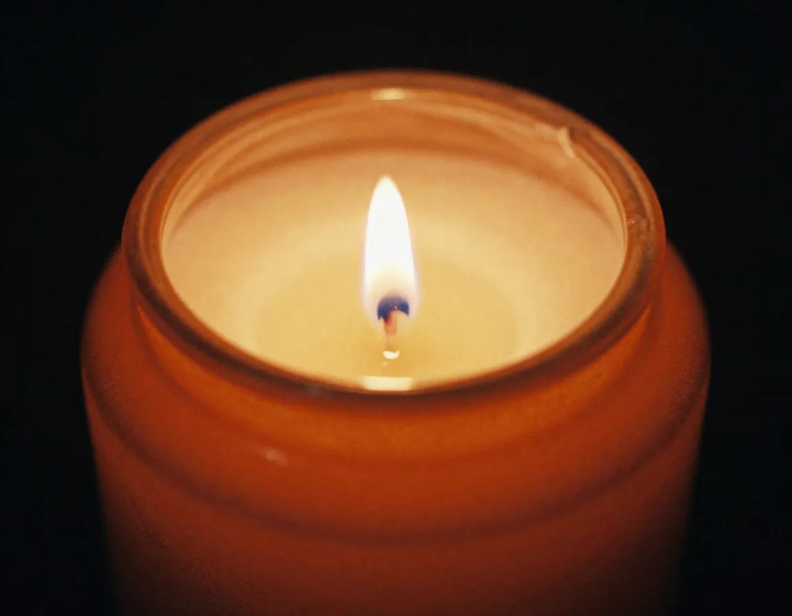 Amber Glow scented candle with warm orange tones